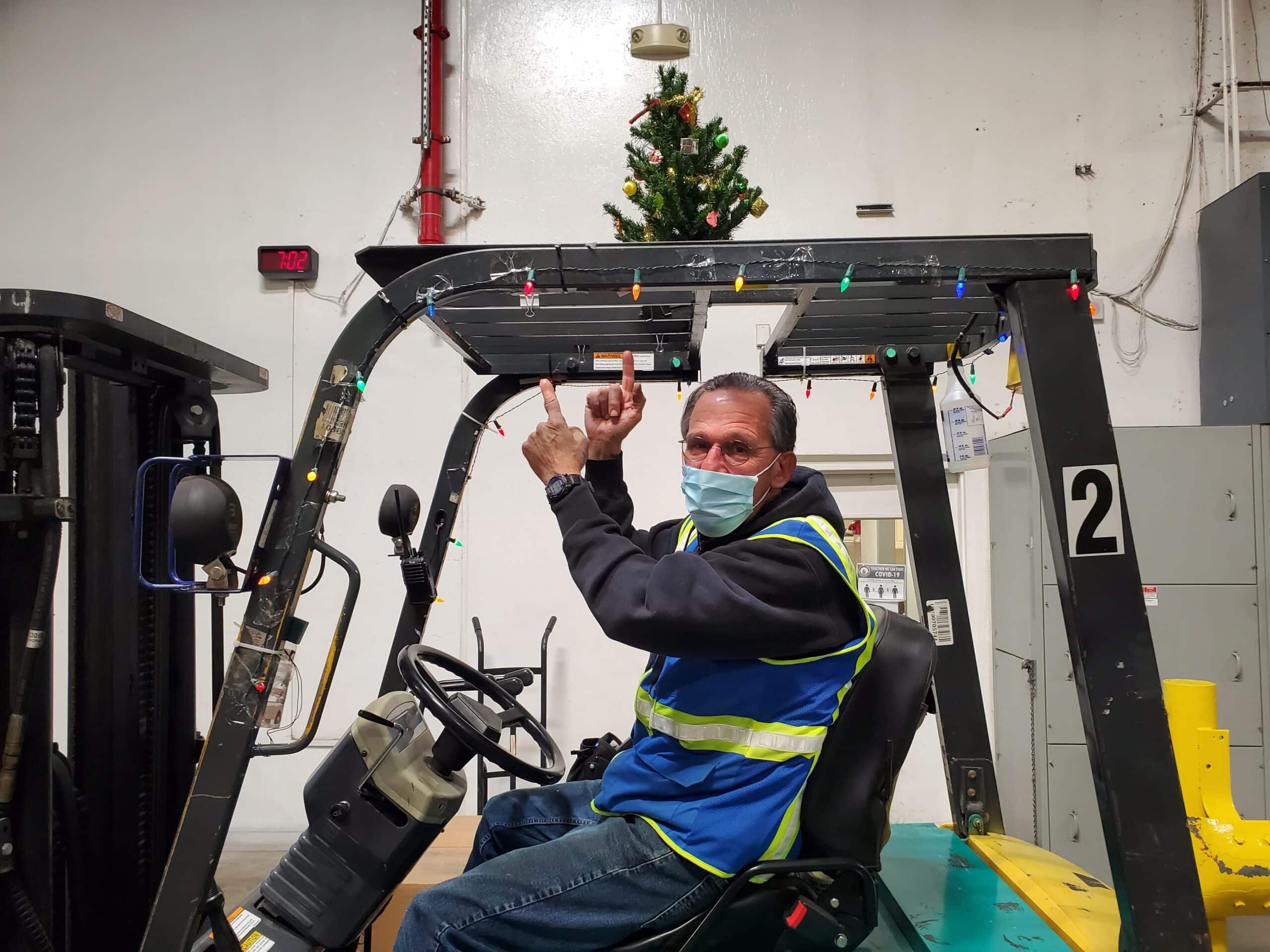 Man In Forklift With Mask Holiday