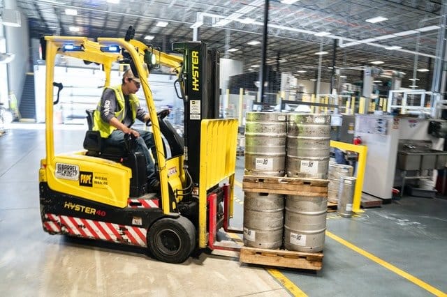 Image Of Forklifting Drums In Warehouse
